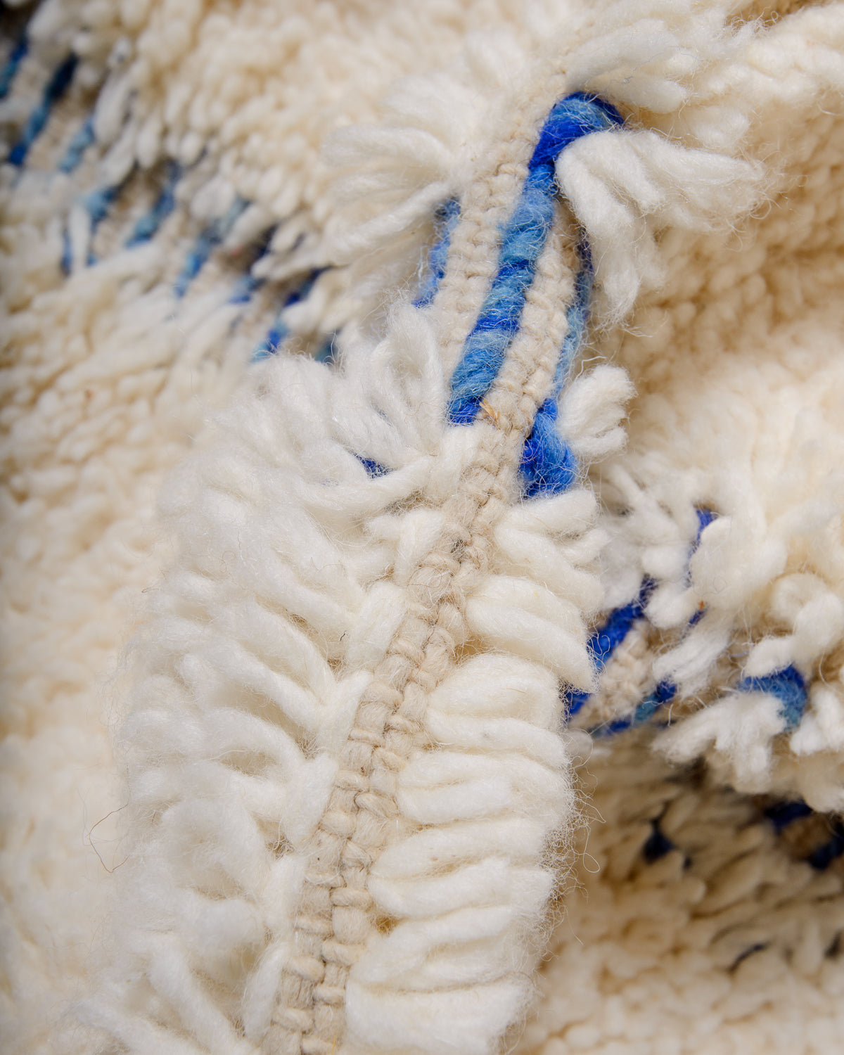 Modern, designer, handcrafted Berber rug from Morocco. Beniourain carpet with minimalist design, natural wool pile and a fluffy texture.
